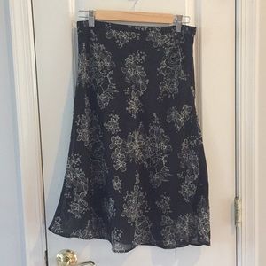 Size 6 (runs small) black skirt with cream flowers